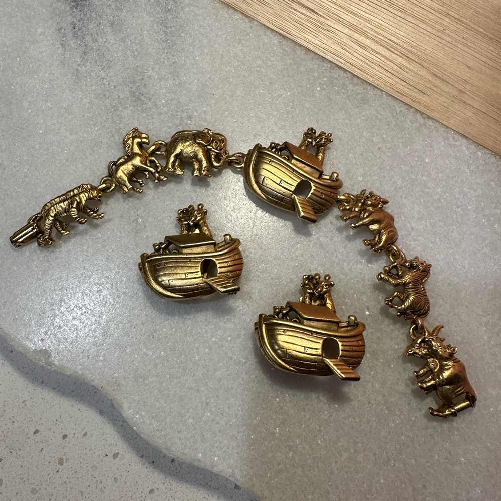Gold Noah's Ark Set bracelet and clip on earrings signed A.J.C.